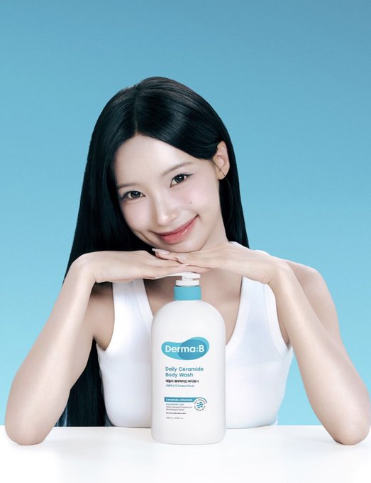 An advertisement showing a smiling woman posing with a bottle of 'Derma:B Daily Ceramide Body Wash' against a blue background.