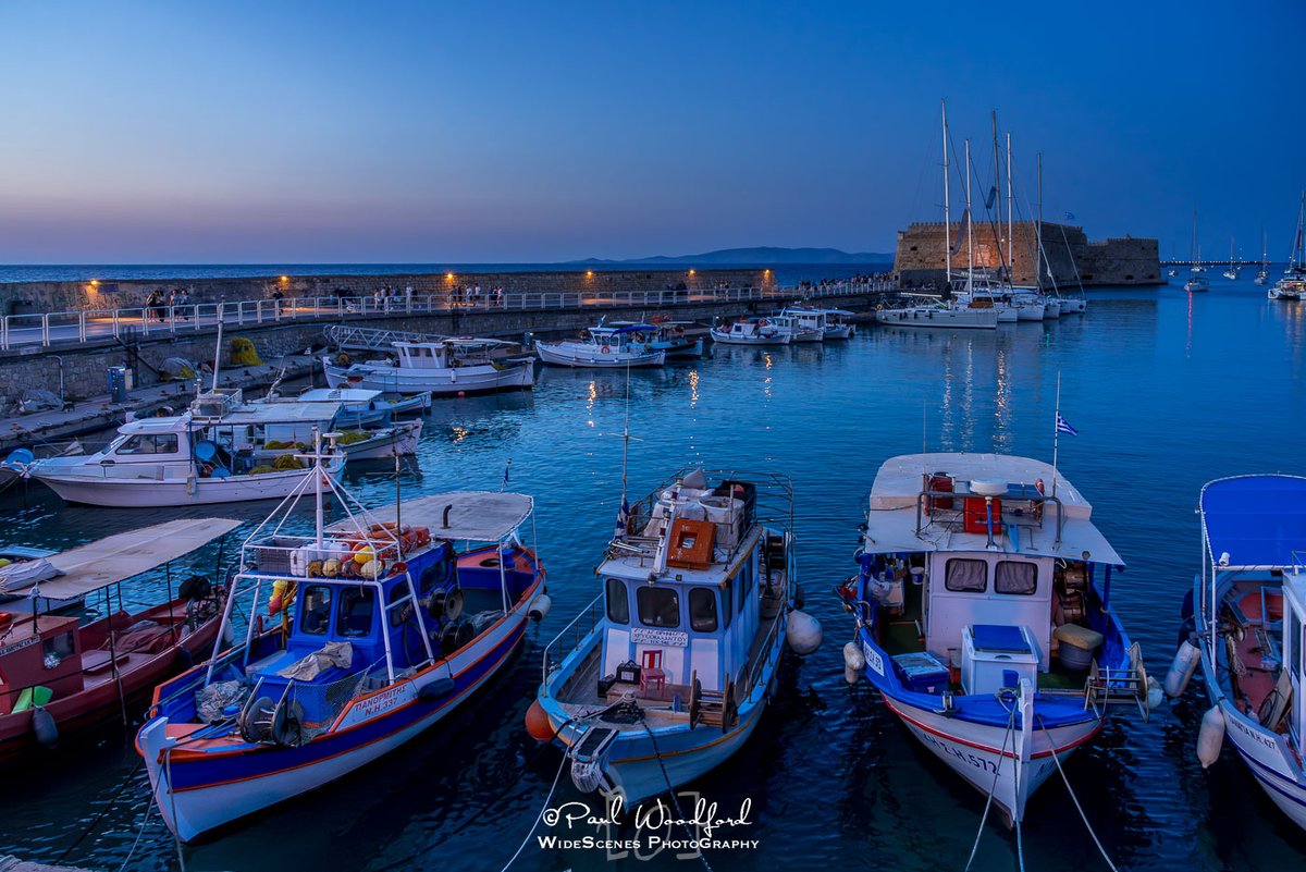 MartaFlor7's tweet photo. Blue hour in Heraklion, Crete. Shot handheld to keep the boats crisp—my excuse for skipping the tripod. Sony A7R III + 24–105mm f/4 | 24mm, f/8, 1/30, ISO 4000 https://t.co/BFoRS8hoQj