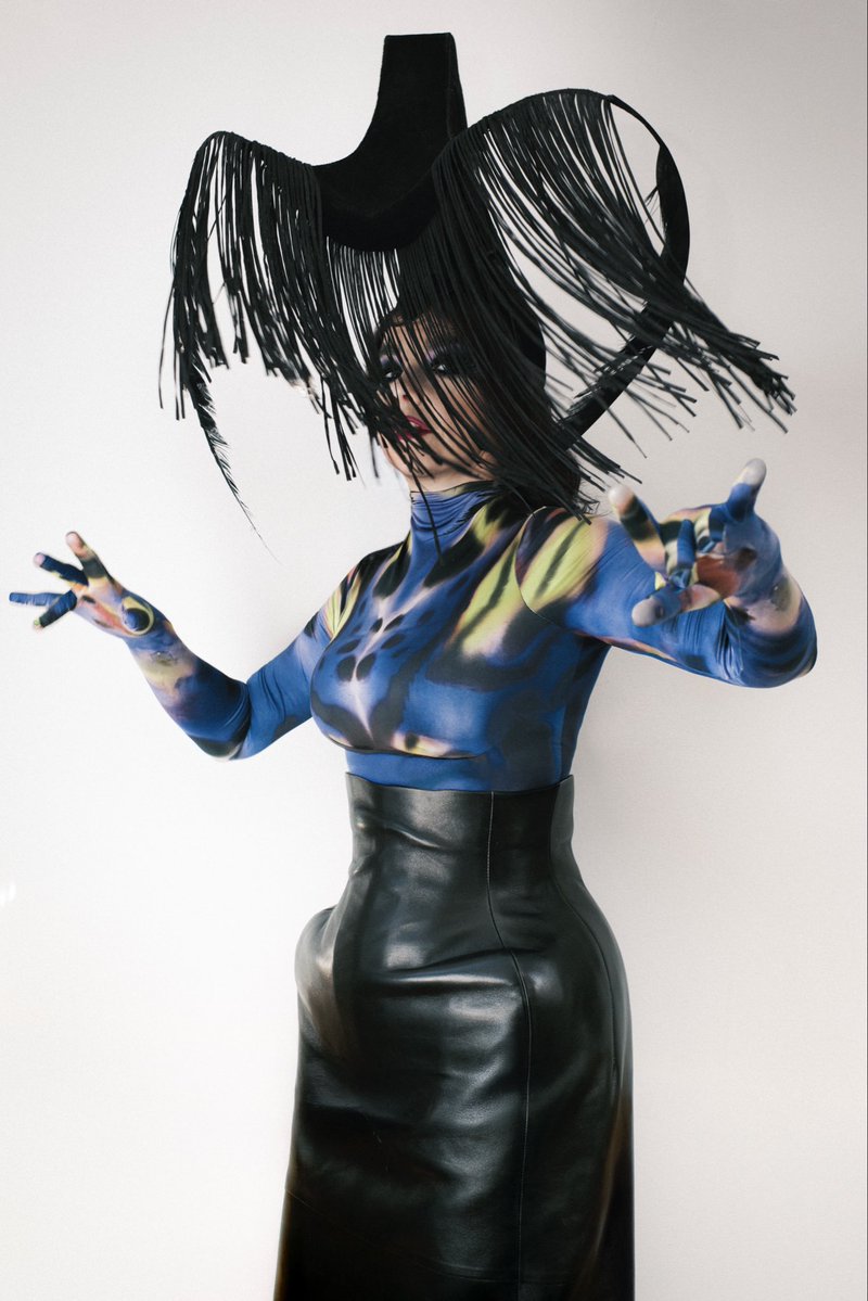 bjork's tweet photo. i am so honoured to be wearing clothes from the mythological mugler , i remember seeing exhibition with hungry and seeing upclose the miraculous craft , textiles and patterns : biological sci fi galore ! it was a tall order for miguel to express that fantasy as a confident continuation of the archives but he nailed it !!! magical to combine an archival hat with miguels best !! congratulations !!! 
warmth , 
björk

Outfit Mugler
Styling Edda Gudmundsdottir
Makeup Andrew Gallimore
Photo Vidar Logi

Full story : https://t.co/h063asz9d7