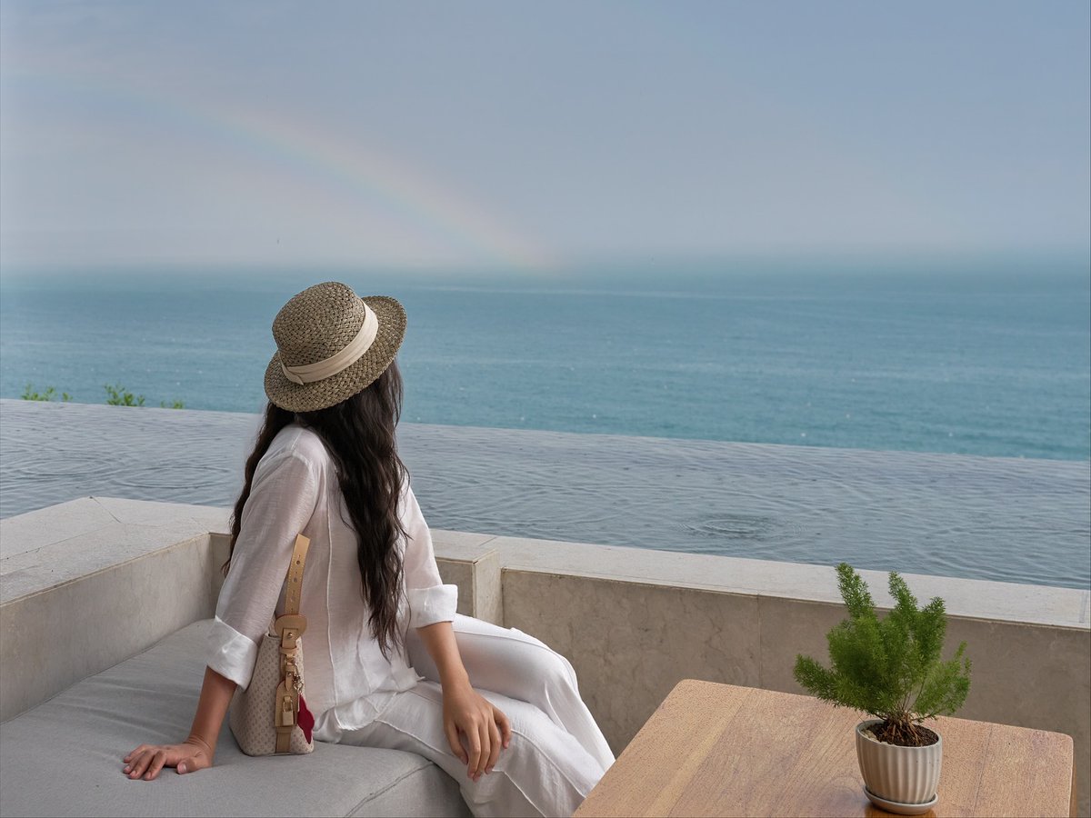 ashok_viga's tweet photo. From the cliffside villas of @mia_nhatrang, the ocean meets the sky in an endless horizon. After soft rain veiled the bay in silver, a radiant rainbow appeared, a serene, timeless moment of nature’s finest luxury. https://t.co/1RwP6ALeBL