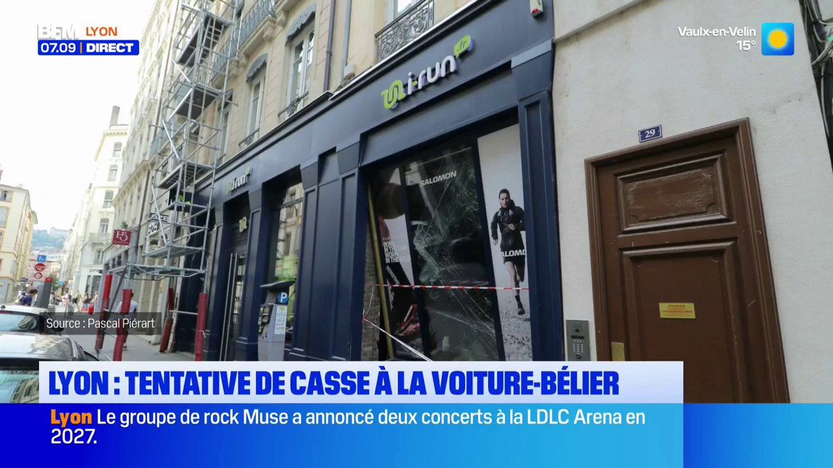 A BFM Lyon news broadcast at 07:09 reports on an attempted ram-raid break-in at the "i-Run" store in Vaulx-en-Velin, showing the storefront's shattered window display secured with red and white tape, alongside an advertisement featuring the Salomon brand.