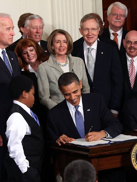 Handre's tweet photo. Barack Obama signed the Affordable Care Act in March 2010, guaranteeing you cheaper insurance, more competition, and the ability to keep your doctor. Premiums for individual plans more than doubled between 2013 and 2017. Deductibles climbed so high that millions of technically "insured" Americans still skipped medical care because the out-of-pocket costs were prohibitive. 

The government mandated what your insurance must cover, forced healthy young people to subsidize older high-risk pools, and then expressed genuine surprise when prices spiked. Prices always tell the truth.

The 2009 stimulus, officially $831 billion, operated on the Keynesian assumption that government spending creates wealth. Government spending transfers wealth, first taxing or borrowing it from the productive sector, then routing it through political channels where efficiency is nobody's personal concern. The "shovel-ready jobs" Obama later joked about produced no measurable acceleration in recovery. The recession that followed 2008 should have cleared in 18 months, as previous sharp downturns historically did when left alone. The Obama recovery took a decade and delivered the weakest GDP growth of any post-war expansion on record.

Dodd-Frank, signed in 2010, weighs 2,300 pages. Community banks spent compliance budgets they never had, and roughly 1,900 small banks vanished between 2010 and 2016. The big institutions that actually caused the 2008 crisis absorbed the regulatory cost with ease and used the new complexity as a competitive moat. Regulations written by large players consistently protect large players. The middle-class small-business owners who needed credit found fewer lenders willing to offer it.

Obama also expanded drone warfare to seven countries, assassinated American citizens without trial, and extended the surveillance state through a reauthorized PATRIOT Act, which undermines any libertarian's case that the Democratic Party is less hostile to civil liberties than its competition.

Then there was Cash for Clunkers, which destroyed 690,000 working cars in 2009 by crushing them with sodium silicate. Mechanics lost parts inventory. Buyers on a budget lost affordable transportation. Prices for used cars spiked. You paid more so dealers could move new inventory.

A generation of voters watched the government spend $5 trillion across two terms, nationalize health insurance markets, regulate finance into oligopoly, and print money through three rounds of quantitative easing that inflated asset prices and rewarded those who already owned property. You paid higher premiums, earned lower real wages, and watched your savings earn nothing in a deliberately suppressed interest-rate environment. The bill always arrives later. You see the ribbon cutting and the document signing, but you feel the damage to your pocket only years later.