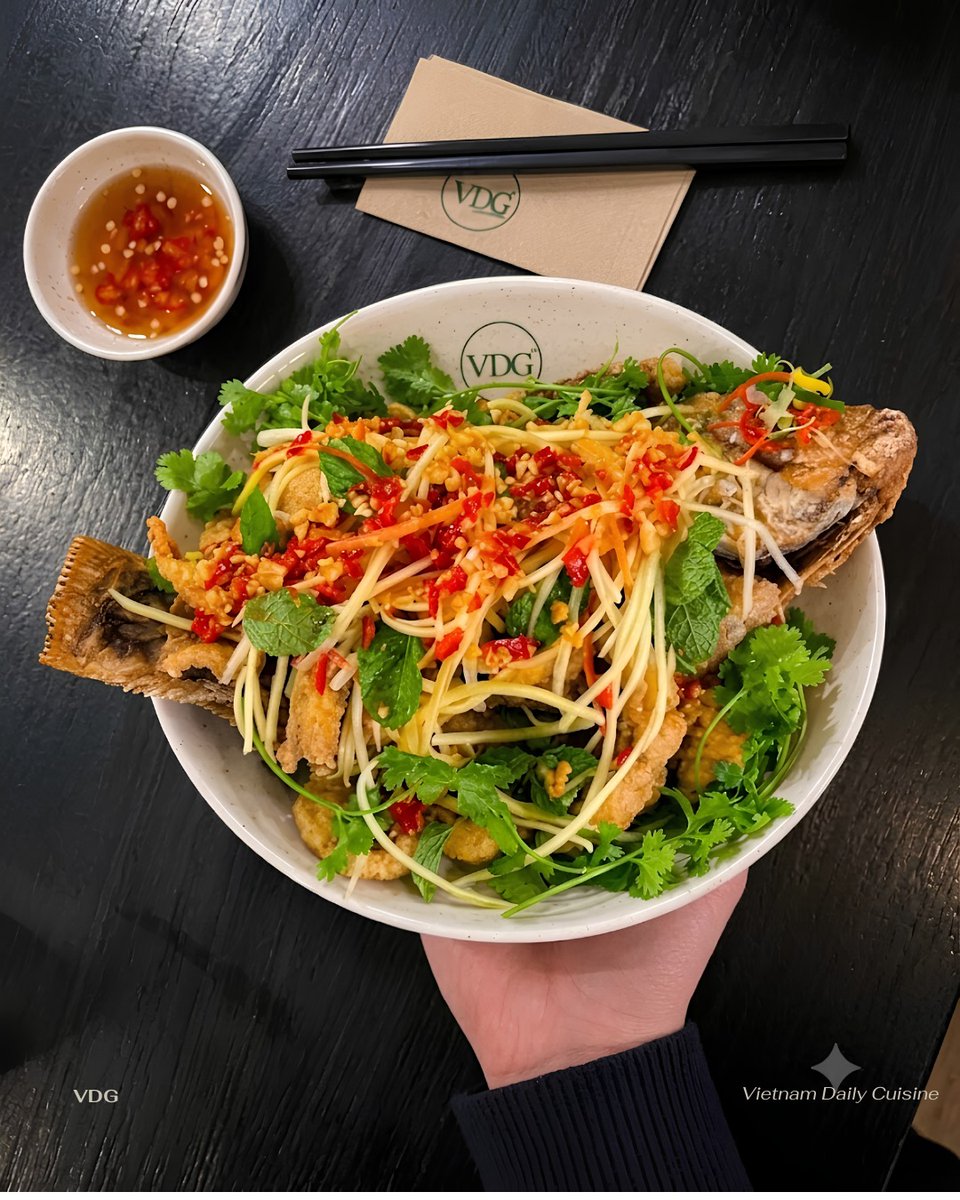 VeroGuebara's tweet photo. Skip the guides: eat like a local in Vietnam with crispy whole fried fish, tangy green mango salad, fresh herbs, and sweet-savory dipping sauce. Best paired with hot jasmine rice. https://t.co/FQMNRZ8nBT