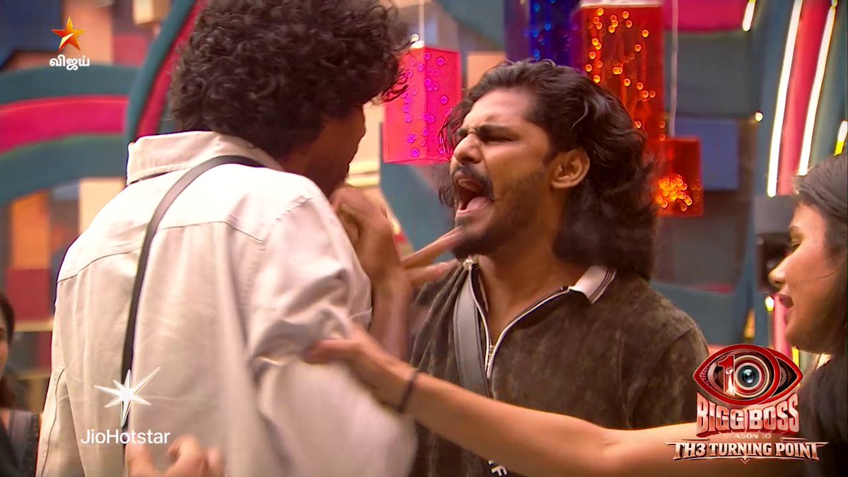 Two men are engaged in an intense confrontation on the set of Bigg Boss Tamil, with one shouting aggressively at the other while being held back, as the "Bigg Boss H3 Turning Point" logo, JioHotstar watermark, and Vijay TV star logo are visible on screen, promoting Day 29 of Bigg Boss Tamil Season 10 hosted by Vijay Sethupathi.
