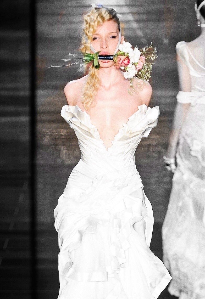 pmamtraveller's tweet photo. The dramatic ruffled white bridal gown with rope-wrapped arms and a floral gag from Samuel Cirnansck's Spring/Summer 2012 collection shown at São Paulo Fashion Week. https://t.co/0mGDkfS98A