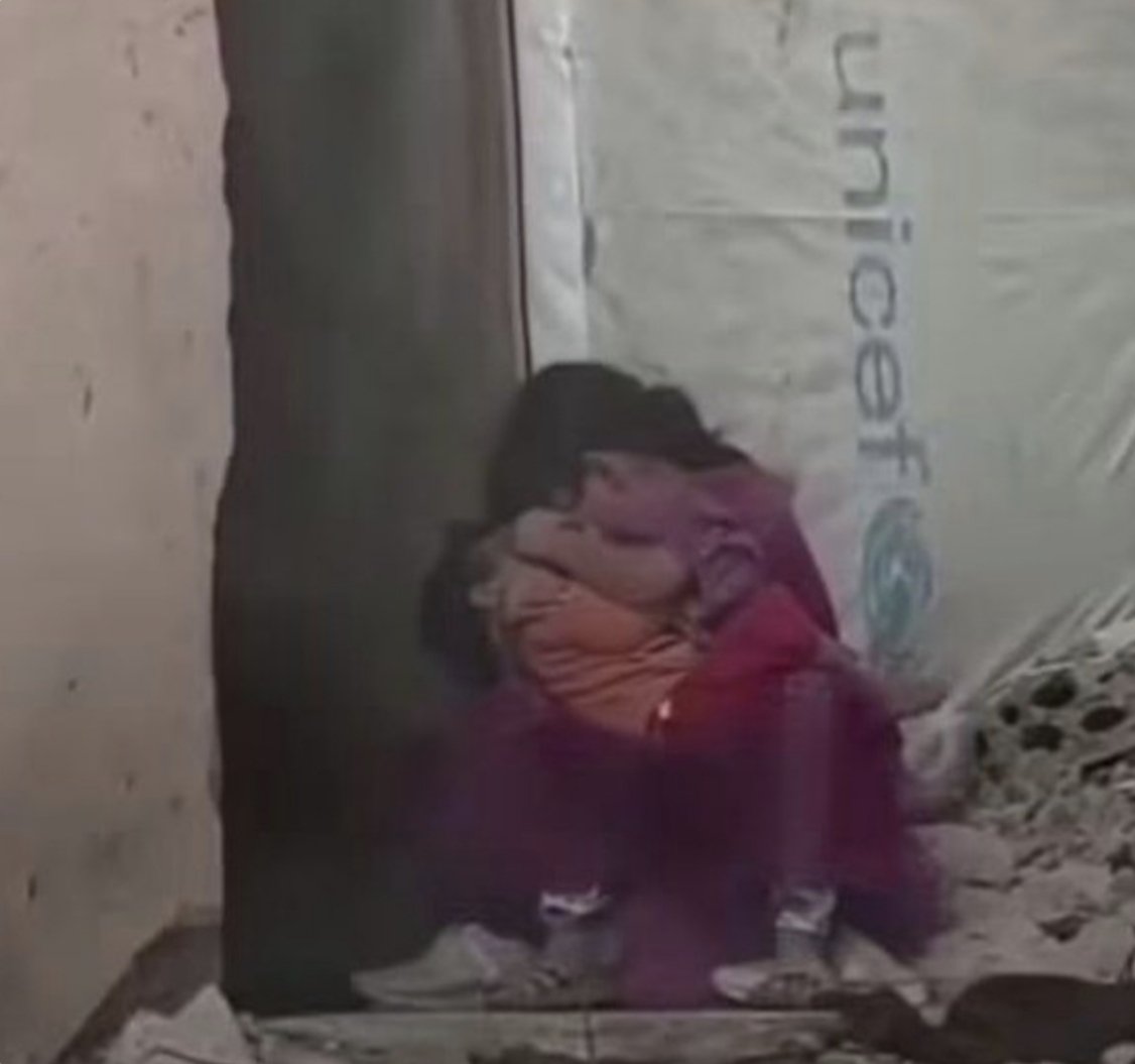 HaithamElmasri1's tweet photo. Two little girls searching for safety in each other’s arms, after the world failed to protect them.

This is not merely a picture of two children; it is a picture of childhood being slaughtered before the eyes of the world. https://t.co/5O36Wvtuba