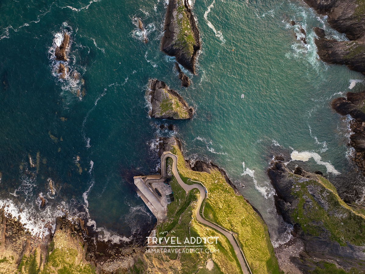 fatimarosel's tweet photo. Dunquin Pier, County Kerry: a winding cliffside path on the windswept Dingle Peninsula descending toward the emerald Atlantic. https://t.co/ty0JAUU4oi