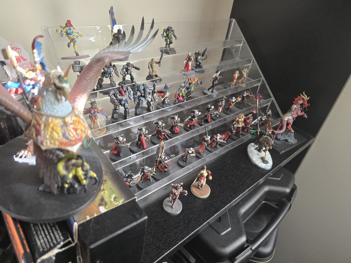 BDoobPixel's tweet photo. @SisterCeciliaVT Praise be!!! I have been rocking a fake sister zealot since launch. Super hyped to play as a real sister. I painted a novitiate team to play kill team with the lads, and a few custom sister models for regular 40k detachments. Also have been drawing a bunch of Argenta art recently https://t.co/5PRv797SeP