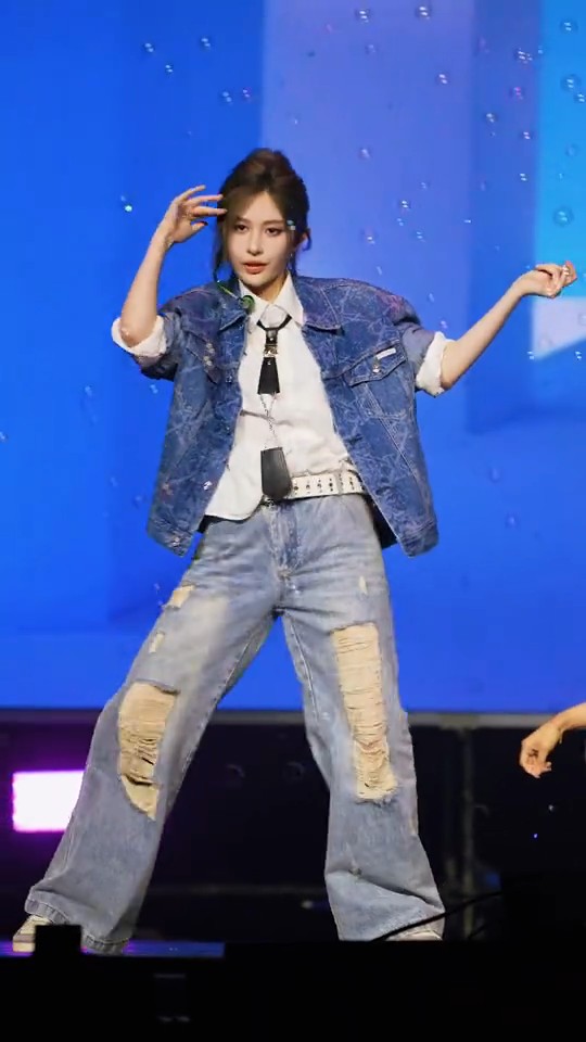 https://i.imgur.com/example1.jpg

Image 1: A female performer is shown on stage in a dynamic pose, wearing a blue denim jacket with a white shirt, distressed blue jeans, and a headset microphone, set against a vivid blue backdrop.

Image 2: A meme showing a woman holding a pink rose in her mouth in bed on top, and a puppy holding a pink rose in its mouth in bed on the bottom, with the watermark "@keepydog".

Image 3: A close-up selfie of a young woman with wet, shoulder-length brown hair wearing a black top.

Image 4: A WhatsApp chat screenshot showing a reply to "@AshuRin" with the message "kita bertahan ya..meskipun cuma vigencia", a profile picture of a smiling woman in a white shirt, and timestamp "19.54".

Image 5: A video view tracker titled "VIDEO VIEW TRACKER: Love On Hire Trailer" showing "1.27M VIEWS ACROSS ALL PLATFORMS", with an image of two women posing on the right.

Image 6: A young woman with short blonde hair is sitting in the back of a green vehicle, wearing a black strapless top and a layered black tulle skirt.

Image 7: A young woman with medium-length brown hair is sitting on a wooden bench with a red and white train behind her, wearing a light green jacket over a brown plaid shirt and brown pants.

Image 8: A young woman with her hair tied back using a butterfly clip, wearing a pink button-down top, with a blurred green outdoor background.

Image 9: A close-up of a woman with short black hair wearing a white collared shirt, captured with a camera interface overlay showing "FIVE SUMMER" and "MENU" text.

Image 10: A female performer is on stage wearing a cream-colored halter top and long flowing skirt, holding a black folder and a microphone, with a blue background displaying Korean and English text including "Complete the exam" and "may not be detected", with a "MENU" camera interface overlay.