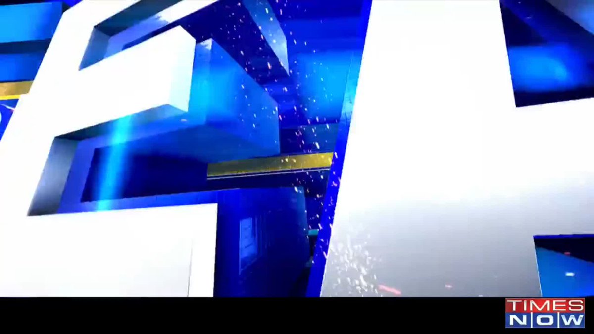 A flashy blue and white animated news intro graphic with sparkles, featuring the 'TIMES NOW' logo in the bottom right corner.