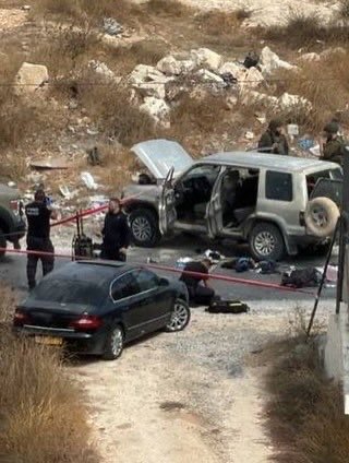 EyeonPalestine's tweet photo. Israeli soldiers take a selfie with the body of a young Palestinian man killed after they opened fire on his vehicle at the entrance to Bani Na’im, near Hebron. https://t.co/7VKdLqzHy8