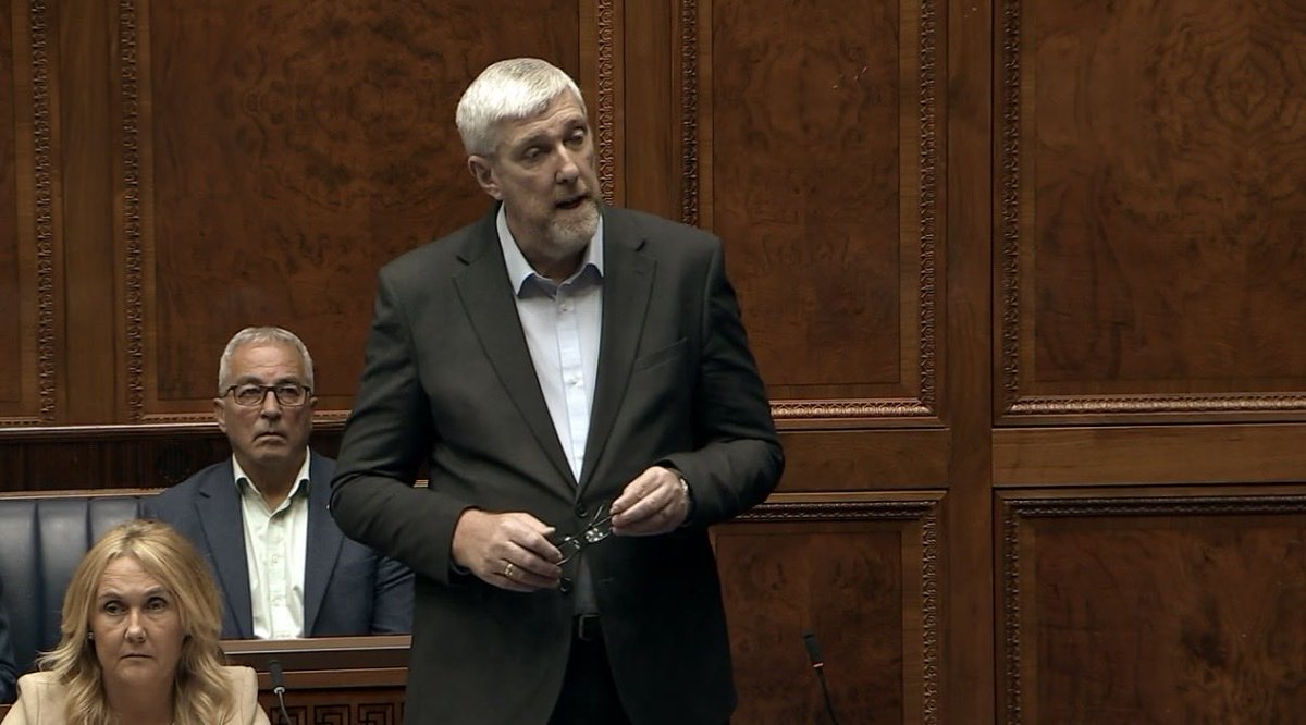 DiscipleElland's tweet photo. Sinn Fein's John O'Dowd has just stood up in the Assembly at Stormont and read out the names of all of the 21 innocent victims who were murdered by Loyalists in the last Drumcree Dispute including the 3 young Catholic children who were burned to death in their home.   It was a very poignant speech.  

Let none of us forget what this is all about -  A sectarian, supremacist organisation (the Orange Order) want to walk through a small Nationalist area where they are not wanted. 
 
We will not let that happen .

🟢  NO ORANGE MARCH
🟢  NO GOING BACK