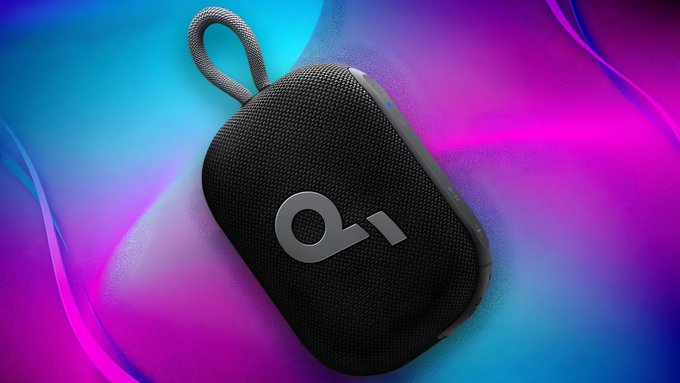 A black Anker Soundcore Select 4 Go portable speaker with a fabric loop handle and "ai" logo is shown against a vibrant pink and blue gradient background, illustrating the discounted audio product featured in the post.