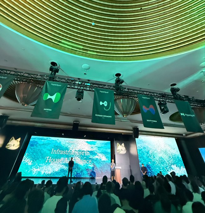 A conference audience listens to a speaker on stage at a Hyperliquid event, with banners representing "Indonesia," "Russian-Speaking," and "South Korea" hanging above the "Infrastructure to House All Finance" presentation backdrop—suggesting Jeff was a notable speaker or guest at this regional community gathering.