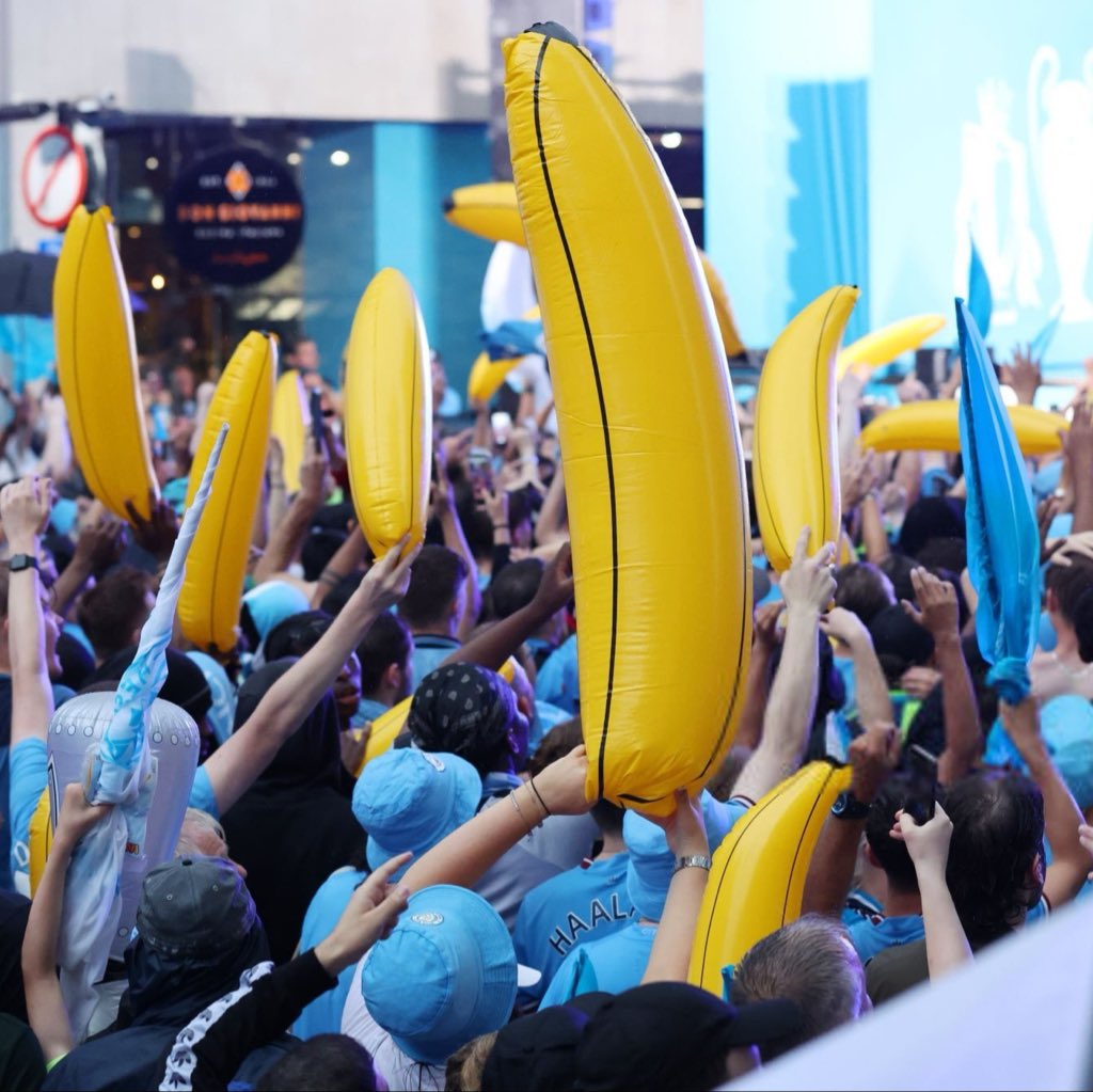 city_exclusives's tweet photo. Travelling Manchester City fans have placed bulk orders for inflatable bananas ahead of the Liverpool match, framing the display as a celebration of club history and a show of support after the committee ruling. Reviving a tradition that began at Maine Road in 1987. 

[via @ManCityMEN ]