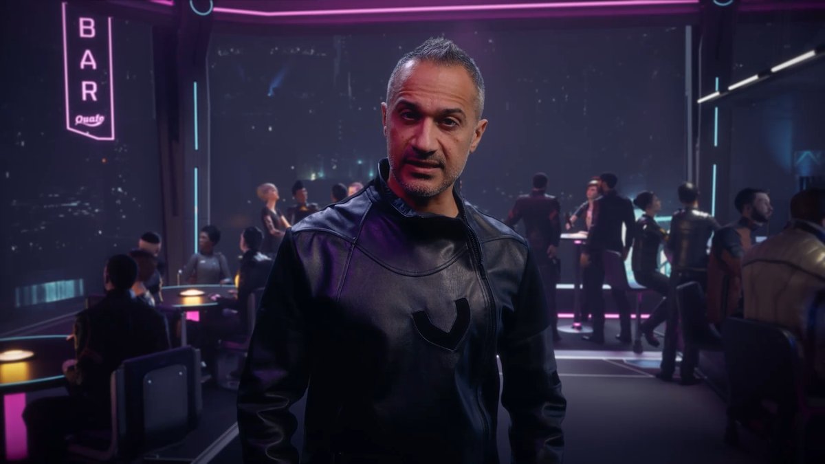 A man in a black leather jacket standing in a neon-lit cyberpunk bar setting with other patrons visible in the background.
