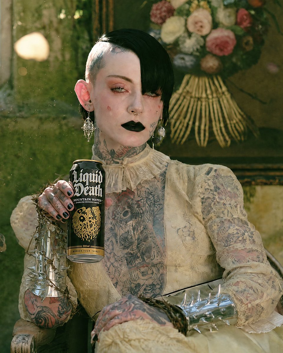 MyRedSelf's tweet photo. I made a #LiquidDeath spec ad campaign "photoshoot", using Midjourney and GPT Images 2.0. (The whole set of images are on my LinkedIn page).

The challenges:

* This was the first time I worked with tattoos, and it was very stressful. Larger and less detailed tattoos could be relatively easier to regenerate. But it is almost never the same tattoos in
regenerations when you are dealing with smaller tattoos, like hand or finger tattoos.

* GPT Images (both 2.0 and 2.5) is still struggling with human anatomy, especially when it comes to "crossed legs". For my legs shot you can see below, I had to regenerate my shot dozens of times, despite using reference images. The legs were either too thin or too long, OR the leg that is behind was fragmented into irrational sections.