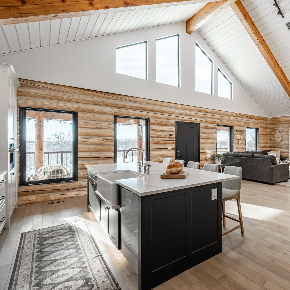 CHBANational's tweet photo. The Log House Reno by Hometown Homes, a member of @SaskatoonHBA, won a CHBA National Award for Housing Excellence after transforming a 1990s log house into a home better suited to a growing family.

The homeowners wanted more space and a more open area for gathering and entertaining. The kitchen was relocated from its enclosed location in the centre of the home into an unused section of the living room, while the former kitchen became an additional bedroom.

That redesign came with challenges specific to a log home. New kitchen windows had to be cut into the log walls, plumbing and electrical had to be rerouted into the new kitchen space, and a thermal imaging gun was used to locate the main floor’s in-floor heating lines so they would not be damaged during jackhammering.

Take a look through the before-and-after photos, then read the full story behind The Log House Reno:
https://t.co/AiniwMHAud

#CHBAHousingAwards #RenovationMonth #RenoMonth #WholeHomeRenovation