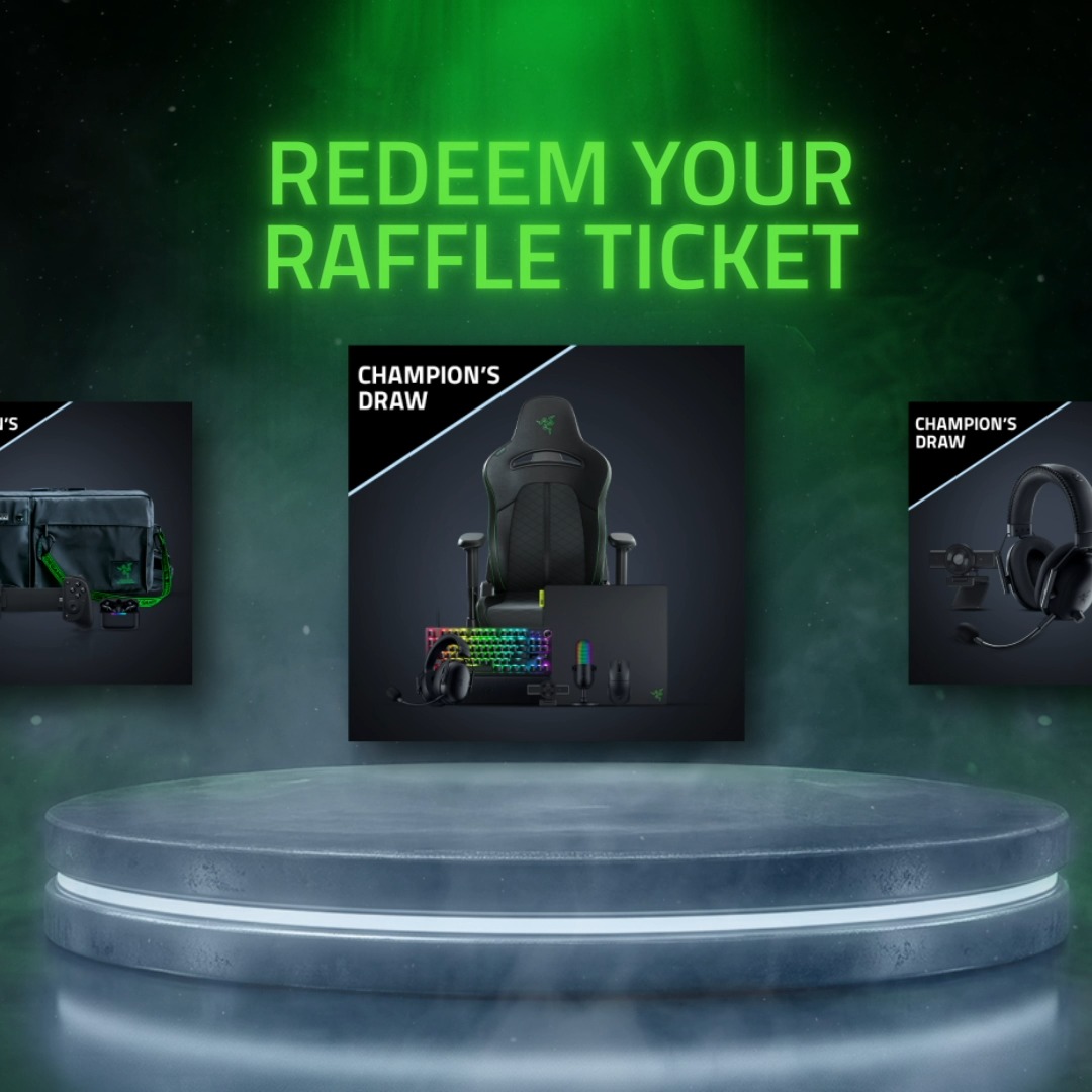 A glowing "REDEEM YOUR RAFFLE TICKET" headline in neon green sits above a metallic podium displaying "CHAMPION'S DRAW" prize bundles featuring Razer gaming gear including a gaming chair, keyboard, mouse, and headphones, with partial views of additional Champion's Draw prize cards on either side—visually promoting the Razer Silver Bounty Fest giveaway mentioned in the post.