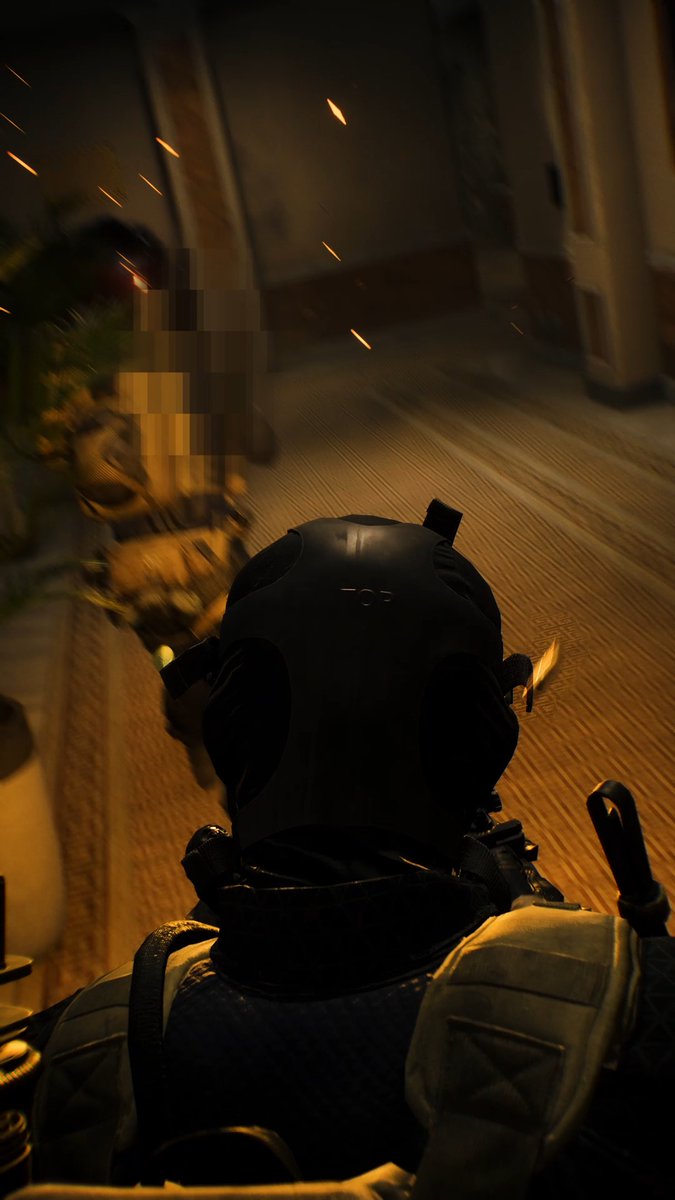 A first-person view from behind a character in tactical gear and helmet, facing another blurred figure in a dimly lit corridor with sparks flying, appearing to be from a video game.