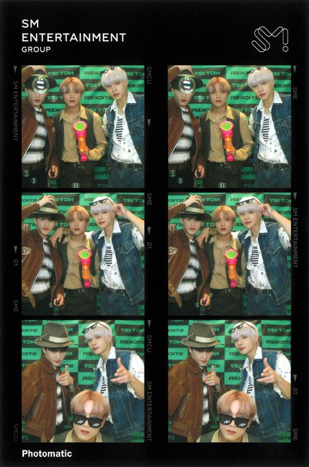 A SM Entertainment Group 'Photomatic' strip featuring three young men posing in various playful positions, with green toy water guns and wearing striped shirts and hats.