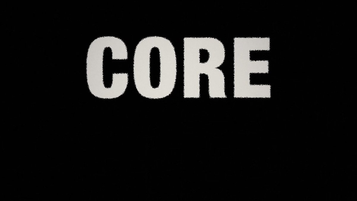 The word "CORE" is displayed in bold white letters against a black background.