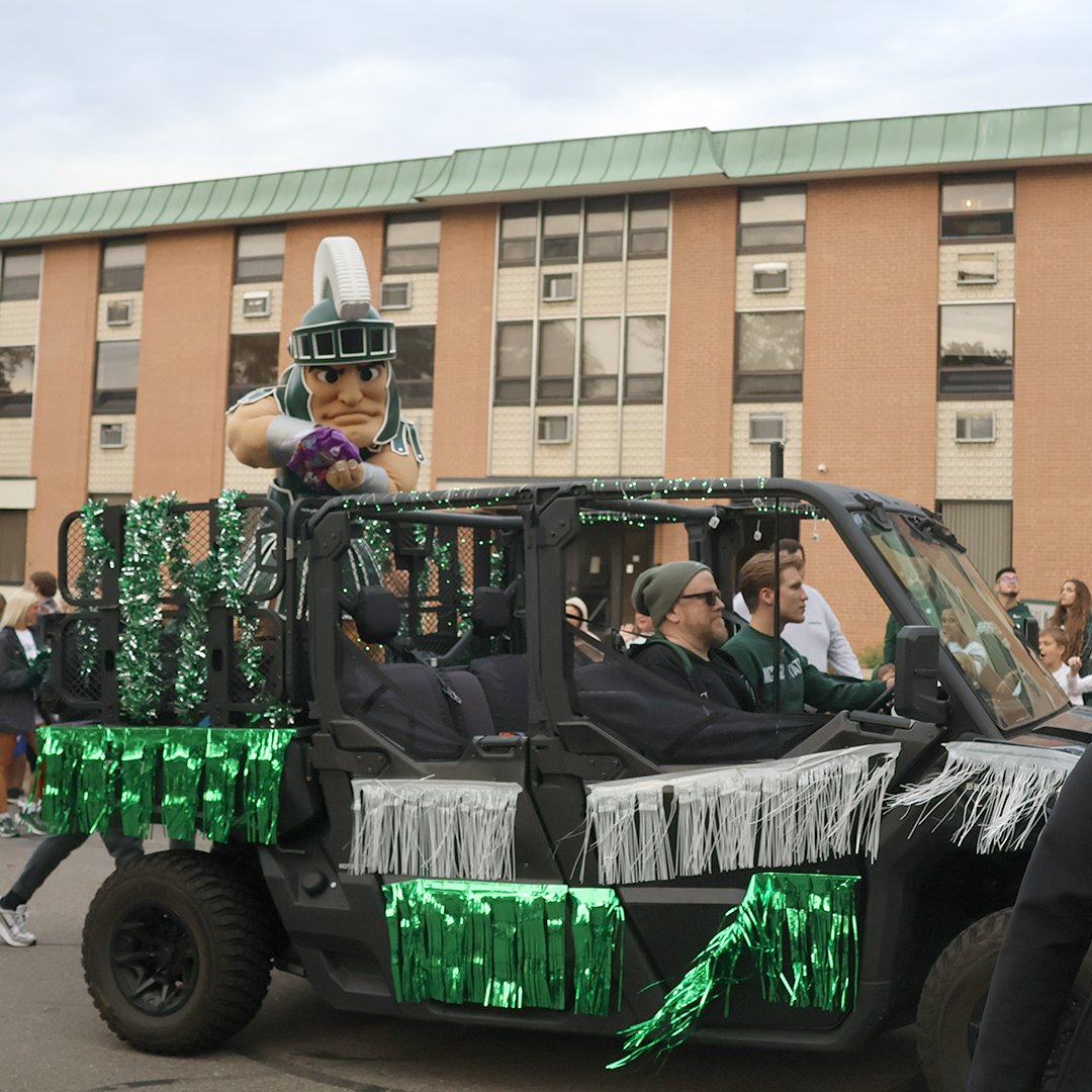 CityofEL's tweet photo. Community members are encouraged to dress in their green-and-white gear and come out to line the streets for the 2026 Michigan State University Homecoming Parade, which will take place Friday, Oct. 9. (1/2) https://t.co/2GveZMTEfR