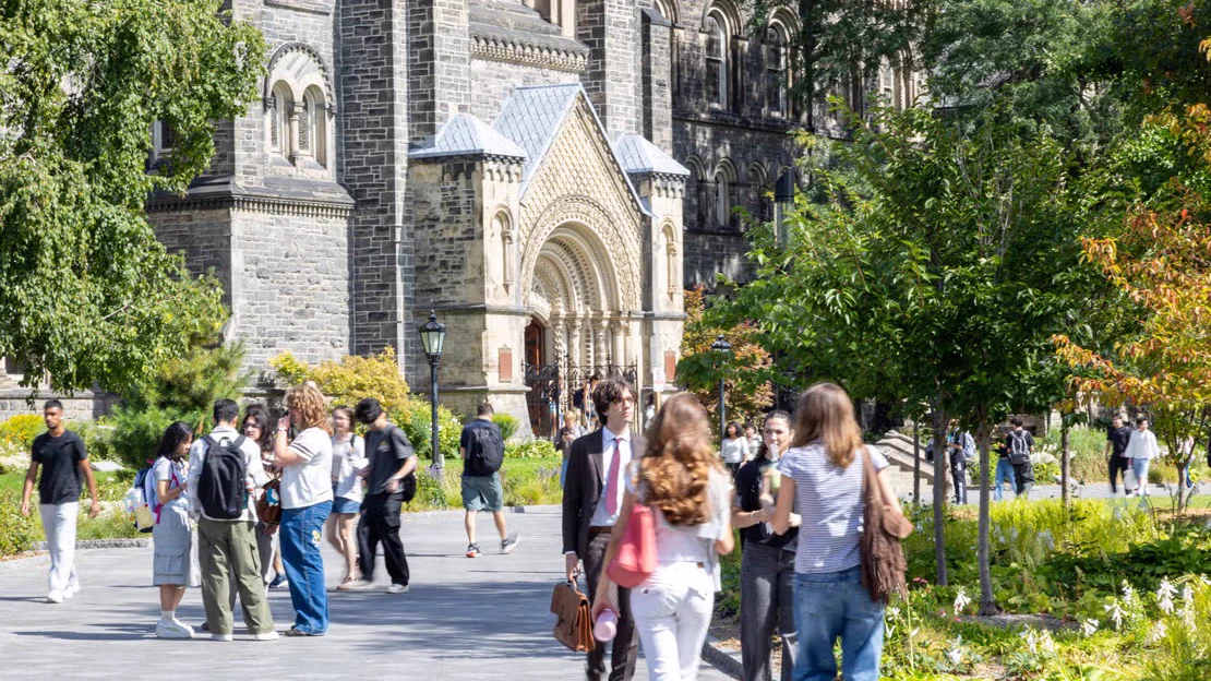 U of T students walking by University College on King’s College Circle
