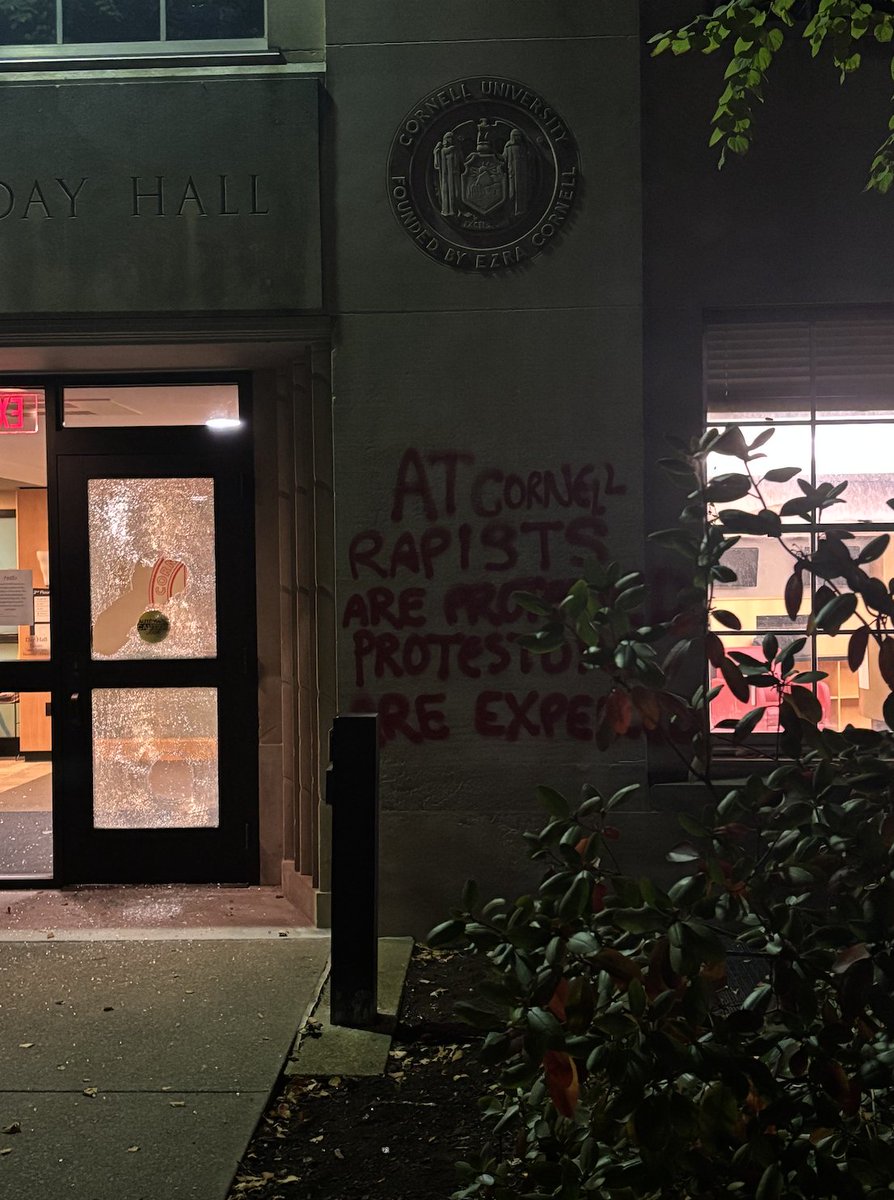 emmabgo's tweet photo. In the early hours of Monday morning, the door of Cornell's main administrative office was smashed. Red graffiti there reads: "At Cornell rapists are protected protesters are expelled.” reporting w/ @maiarcoleman @SantulN  https://t.co/y0IaaEyn1U https://t.co/hC84doVjUe