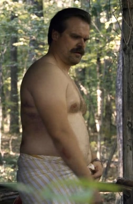 Charismah411's tweet photo. David Harbour shirtless at the beach https://t.co/gZ0O7JOekR