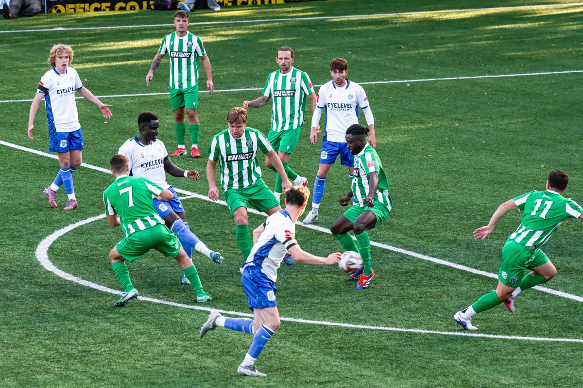 GomboczSteve's tweet photo. Some more player action photos taken during the game between Bury v Bromsgrove on 3/10/26. In one photo Mo Touray slides the ball past the goalkeeper for the 2nd goal. @buryfcofficial #bfc140 #shaker #BuryFC #PartOfit @whitebluearmy https://t.co/xYxcYK4UVK