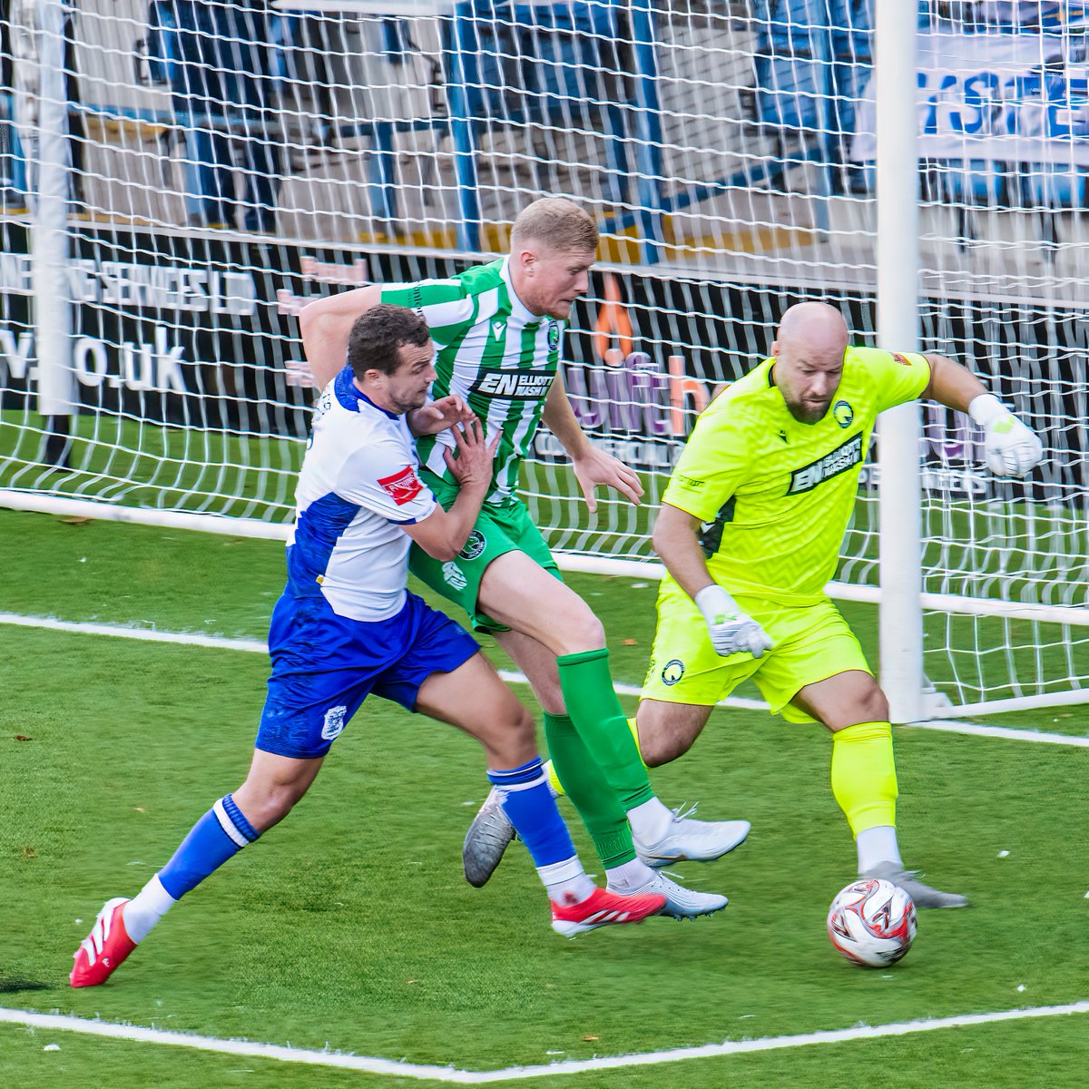 GomboczSteve's tweet photo. Some more player action photos taken during the game between Bury v Bromsgrove on 3/10/26. In one photo Mo Touray slides the ball past the goalkeeper for the 2nd goal. @buryfcofficial #bfc140 #shaker #BuryFC #PartOfit @whitebluearmy https://t.co/xYxcYK4UVK