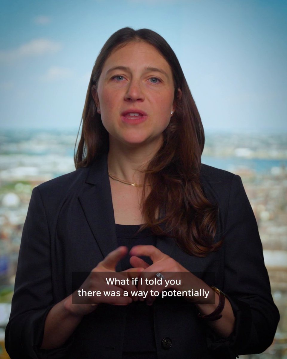 A woman in a dark blazer speaks directly to the camera with a cityscape visible behind her, gesturing with her hands. The on-screen caption reads "What if I told you there was a way to potentially," introducing her explanation of option overlay strategies as a simpler, additional layer of investment protection.