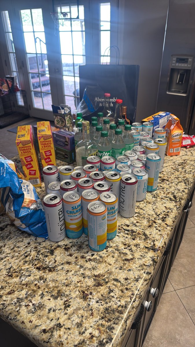 PickledSphinc_'s tweet photo. Ladies staying in an air bnb across the street hawked my roommate down and asked if we wanted the left over alcohol they had. This is what they brought us. Happy Monday. #ChristmasInOctober https://t.co/vKk3COmYy6