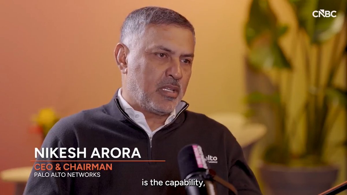 A CNBC interview clip featuring Nikesh Arora, CEO & Chairman of Palo Alto Networks, speaking into microphones with a subtitle reading 'is the capability,'.