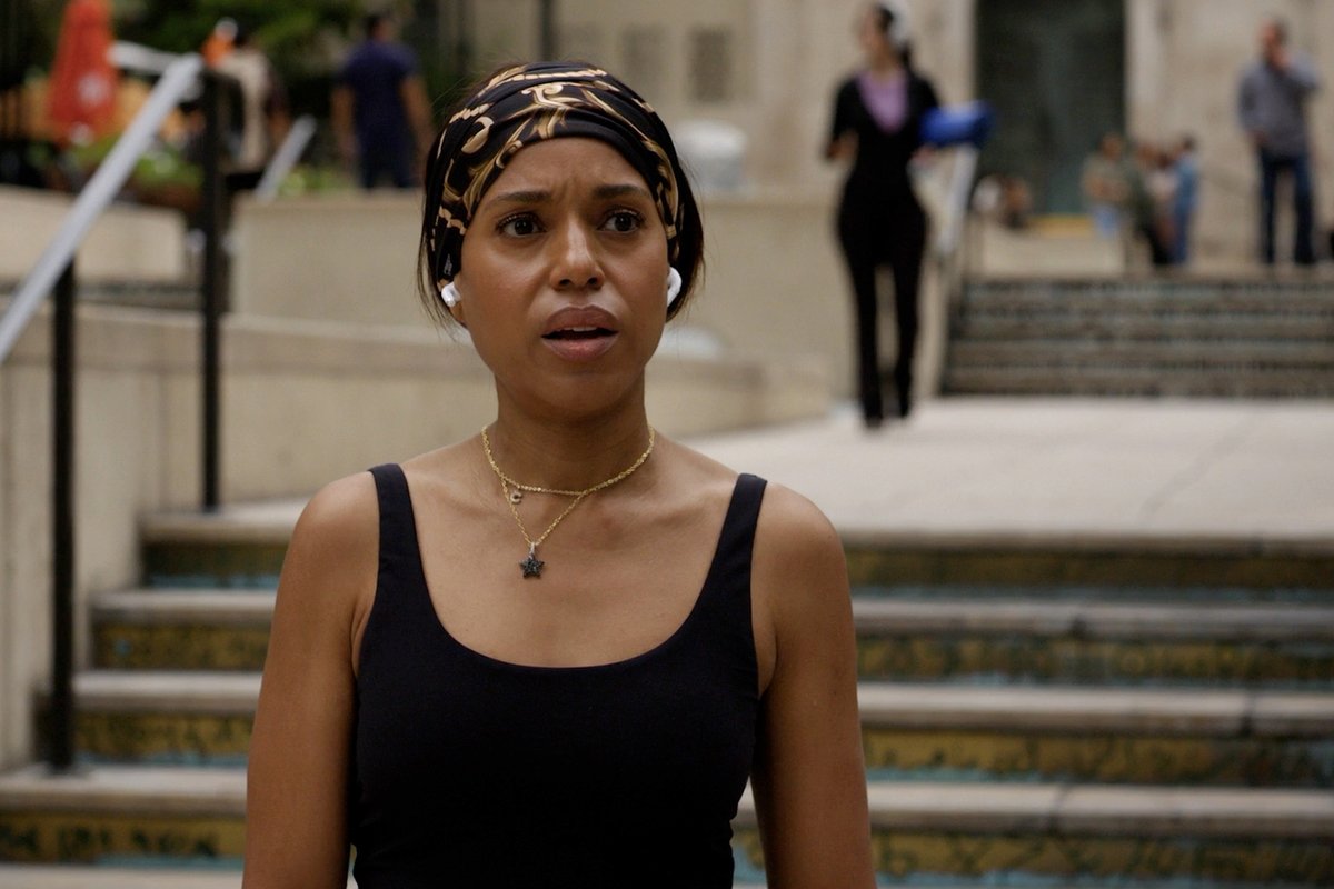 A woman with a black and gold headscarf, black tank top, and star pendant necklace stands on outdoor steps with white wireless earbuds in, her expression serious. The accompanying post about Kerry Washington in Season 2 of "ImperfectWomen" likely refers to her starring role in the series, with the image capturing a dramatic moment fitting the show's tone.