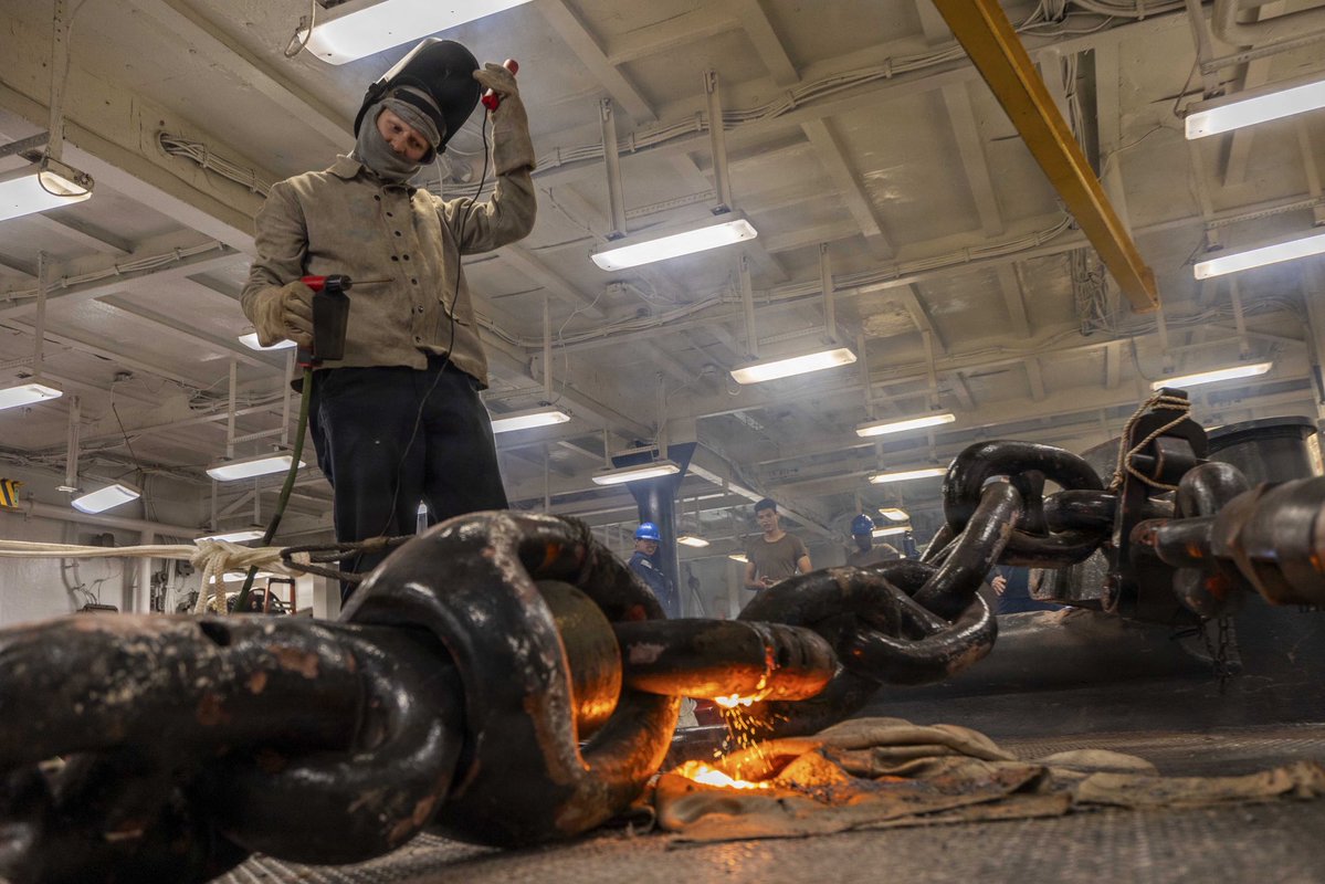 US2ndFleet's tweet photo. Forging Fleet Readiness
U.S. Sailors assigned to Wasp-class amphibious assault ship USS Bataan (LHD 5) use a portable exothermic cutting unit (PECU) to cut and replace a detachable chain link in the ship’s foc’sle, Sept. 23, 2026.
#USNavy #C2f #ForgedToFight https://t.co/BmJJPOKv9h