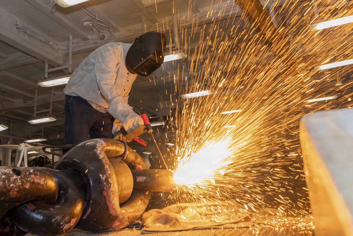 US2ndFleet's tweet photo. Forging Fleet Readiness
U.S. Sailors assigned to Wasp-class amphibious assault ship USS Bataan (LHD 5) use a portable exothermic cutting unit (PECU) to cut and replace a detachable chain link in the ship’s foc’sle, Sept. 23, 2026.
#USNavy #C2f #ForgedToFight https://t.co/BmJJPOKv9h