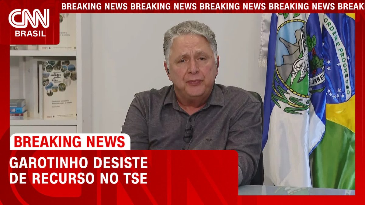 A CNN Brasil news broadcast shows a gray-haired man in a dark shirt speaking in front of flags, with breaking news graphics announcing "GAROTINHO DESISTE DE RECURSO NO TSE" (Garotinho withdraws appeal at TSE), matching the post's headline about the politician abandoning his challenge at Brazil's Superior Electoral Court.