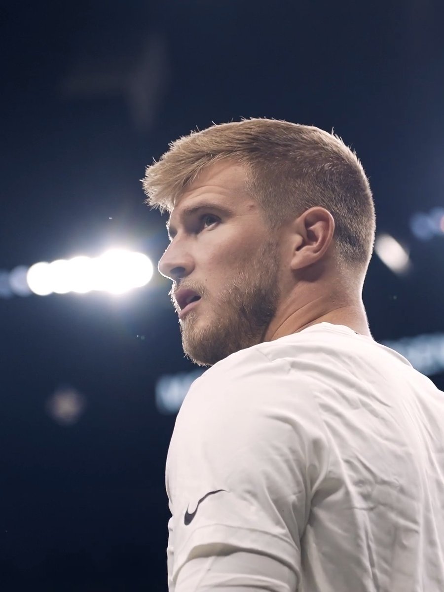 A focused blonde-haired athlete with a short beard is captured in profile wearing a white Nike athletic shirt, with stadium lights glowing in the dark background. The image ties into the "#ATLvsNO" game broadcast on ESPN/WDSU, suggesting a moment from the Atlanta vs. New Orleans sporting event.