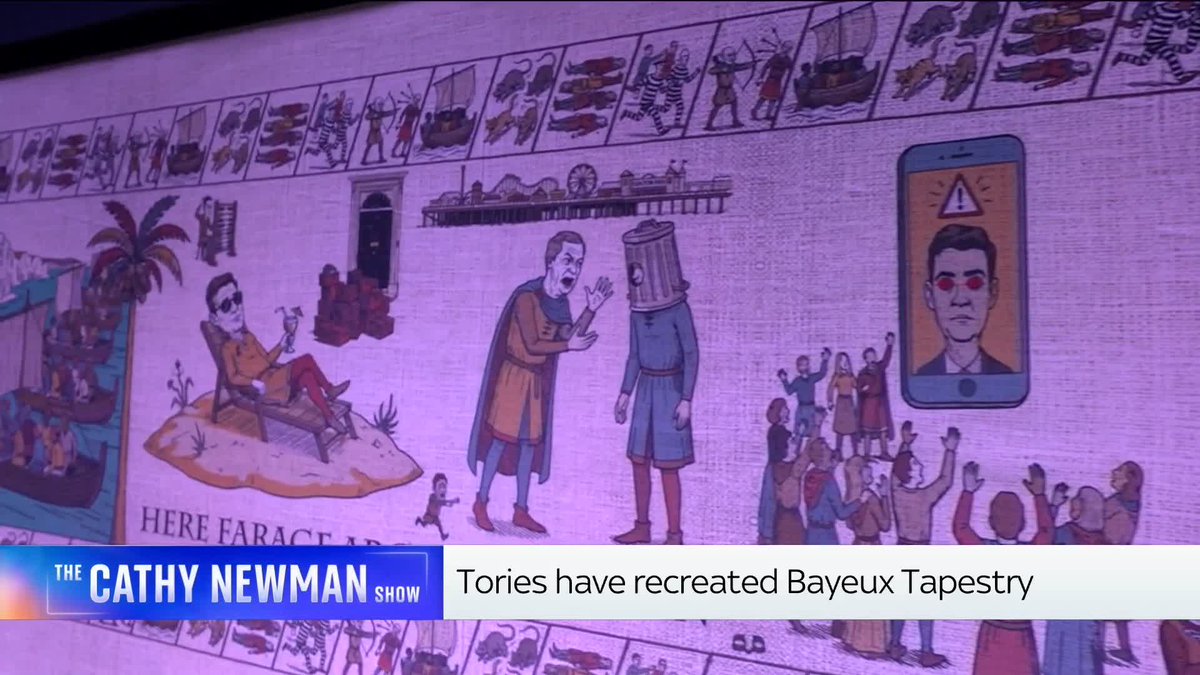 A TV screen displays a satirical recreation of the Bayeux Tapestry by the Tories, featuring a depicted scene mocking Rachel Reeves crying in the Commons while a crowd gazes at her image on a phone, shown on "The Cathy Newman Show" with the caption "Tories have recreated Bayeux Tapestry."