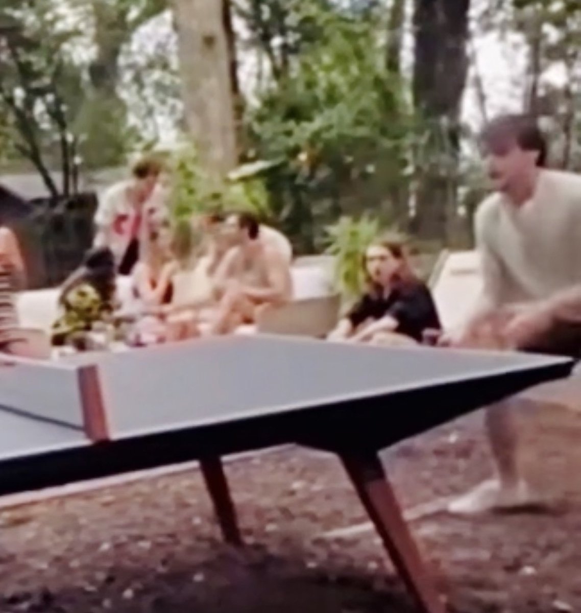 stenthusistic27's tweet photo. Here's a blurry pic and vid of whom I think is Austin abrams (long haired black shirt guy) hanging out with stranger things cast in Charlie's garden in atlanta 2024 
you can see him having the same hair he had in weapons as he was filming it then https://t.co/dcBTagZC6I