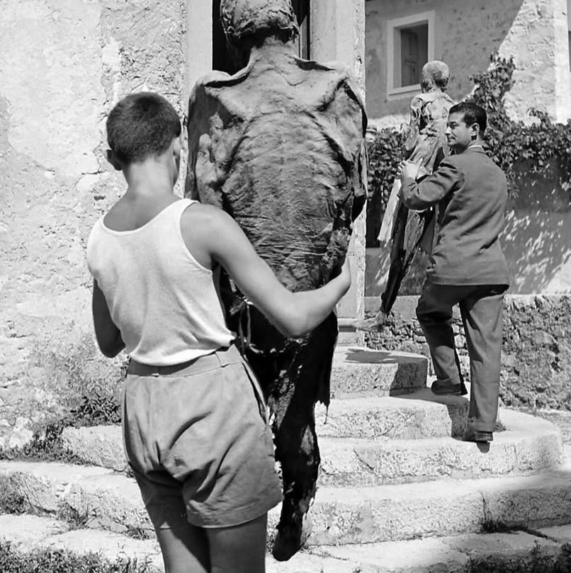 sonnysehra's tweet photo. in 1950, a photographer lost in the alps needed a place to stay for the night and found a rural italian commune, where he saw an old man drinking tea with a mummy. the corpses were from the plague, locals believing it was god’s will for their ancestors to protect the village. https://t.co/TLInAiM8Go