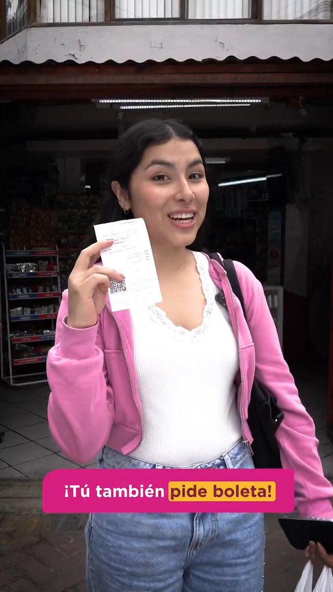 A young woman in a pink hoodie and jeans smiling while holding up a printed receipt in front of a shop, with Spanish text overlay reading '¡Tú también pide boleta!' (You also ask for a receipt!).