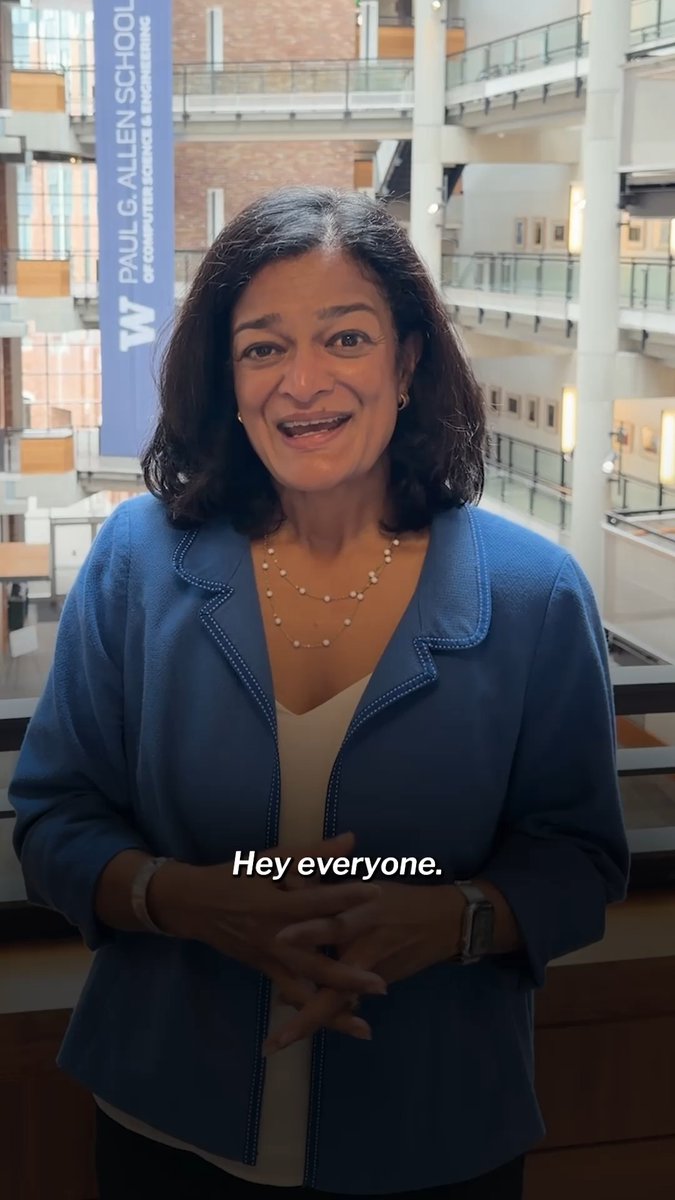 A woman with dark hair wearing a blue blazer speaks to the camera in what appears to be the Paul G. Allen School of Computer Science & Engineering, with the subtitle 'Hey everyone.' displayed.