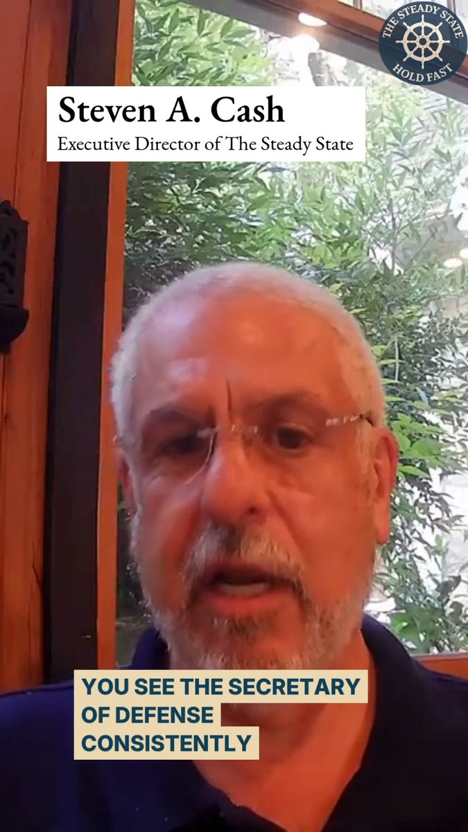 A man with glasses and a gray beard speaks to the camera, identified by text as 'Steven A. Cash, Executive Director of The Steady State,' with the caption 'YOU SEE THE SECRETARY OF DEFENSE CONSISTENTLY.'