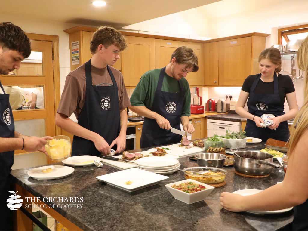 OrchardsCookery's tweet photo. Back in the Kitchen! 👩‍🍳 Our returning Chalet Cooks kicked off week two with beautiful Lamb Racks, while our latest Chalet Cooks began their culinary journey with delicious Duck with a Wild Berry Sauce. 😋✨ https://t.co/Hy8zup6QqX