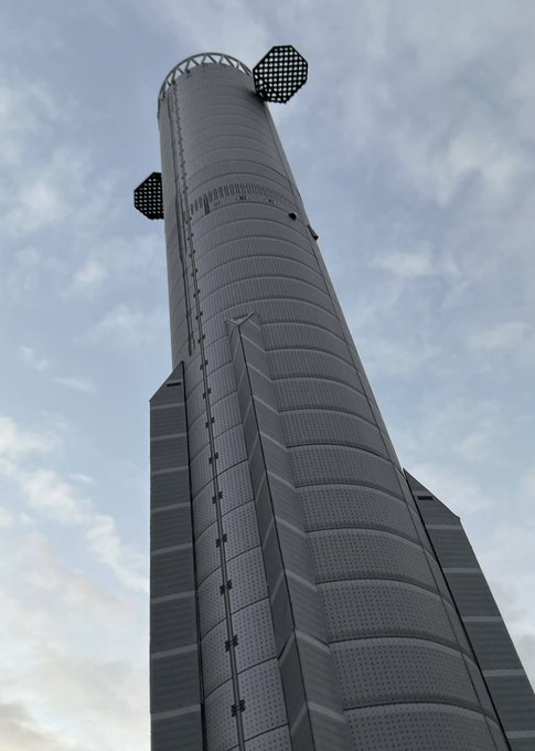 A tall, dark gray modern skyscraper with a perforated, textured facade reaches into a partly cloudy sky.