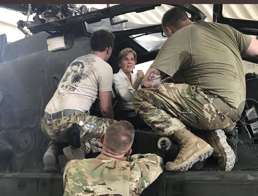 GretchenInOK's tweet photo. Guardsmen gently explain to Elizabeth Warren, still miffed about her hilarious DNA test results after all these years, that an Apache helicopter is no more Native American than she is. https://t.co/ADr7XpREU5