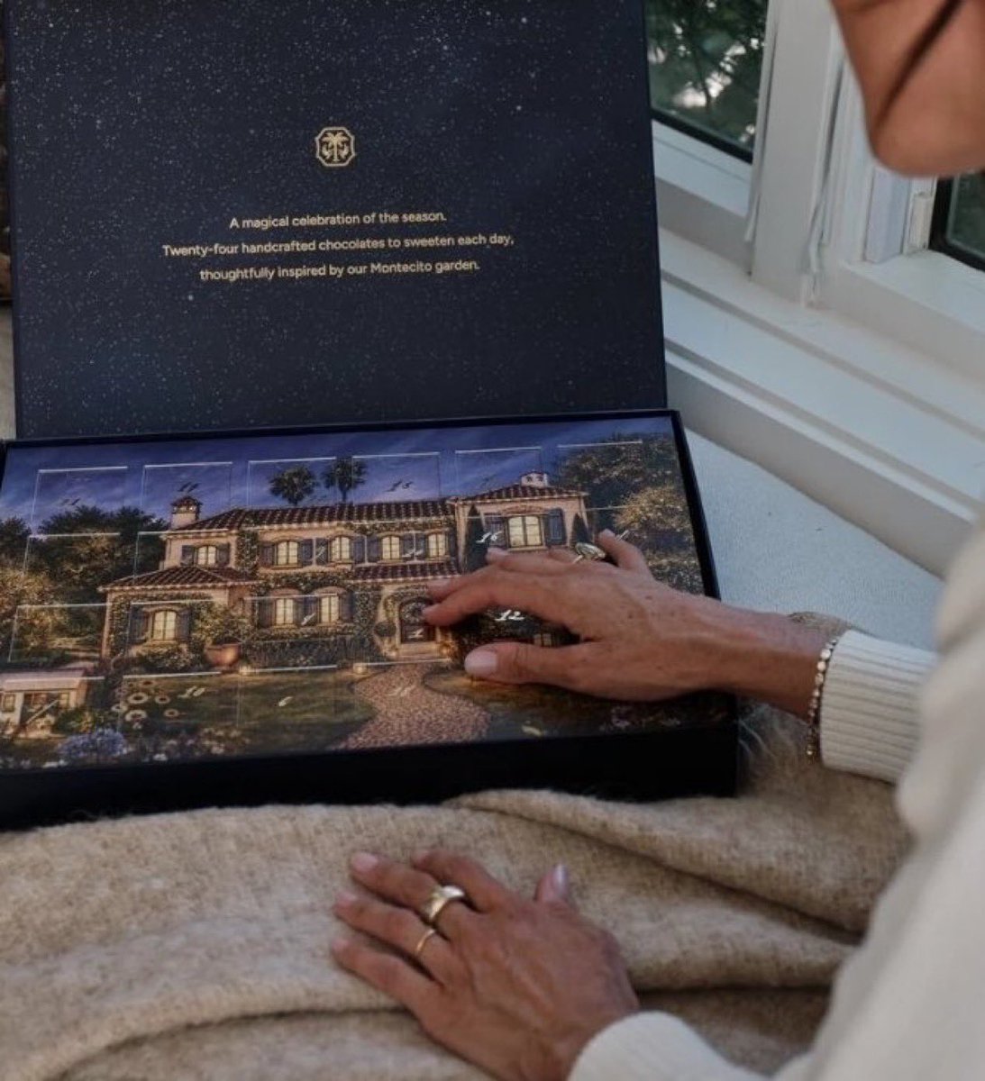 LairdOfThManor's tweet photo. I’m sorry, but what precisely has Meghan Markle’s Montecito McMansion got to do with Advent?

The manger? No.
Mary and Joseph? No.
The shepherds? No.
The three Wise Men? No.
Gold, frankincense and myrrh? Apparently not.

Instead, we have 24 chocolates and a picture of Meghan and Harry’s house, because naturally the birth of Christ was merely crying out for a commemorative rendering of their hideous Californian real estate.

At this point, I’m genuinely struggling to identify the depths to which the self-aggrandisement and commercial rort might descend….although, why am I surprised!🤷🏻‍♂️

Christmas has apparently been reduced to another opportunity to monetise the ‘Meghan Markle Experience’. 🤮

One almost expects the next Advent calendar to contain 24 tiny doors, each revealing a tasteful little portrait of Meghan herself.

Day 1: Meghan.
Day 2: Meghan, but in linen.
Day 3: Meghan holding a lemon.
Day 4: Meghan sitting on a yacht.
Day 5: Meghan holding Harry’s balls….
You get the idea.

Heavens to Betsy. 
I need an eggnog 🎩✝️🎄